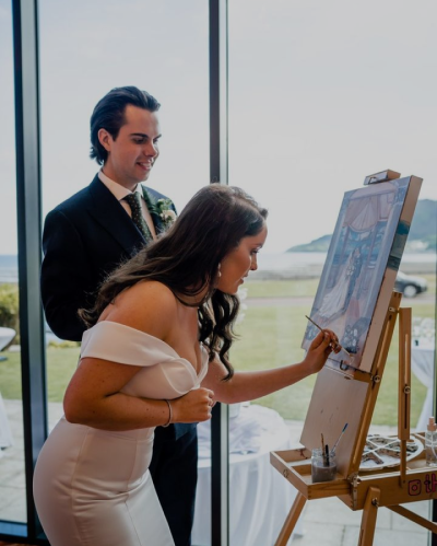 Newlywed couple add their special strokes to the painting